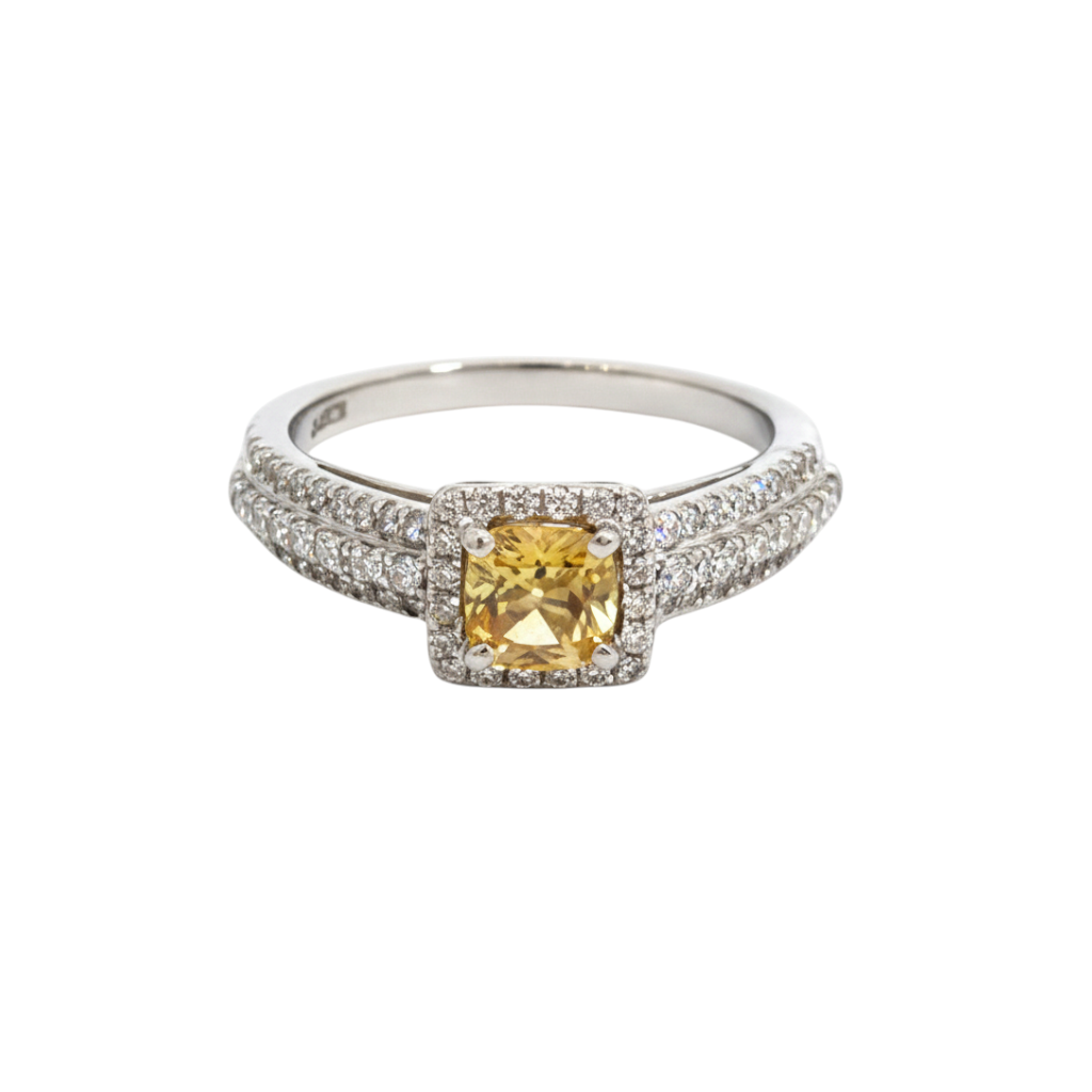 Caribbean Gems 14kt white gold ring with a yellow emerald center stone surrounded by sparkling diamond accents.