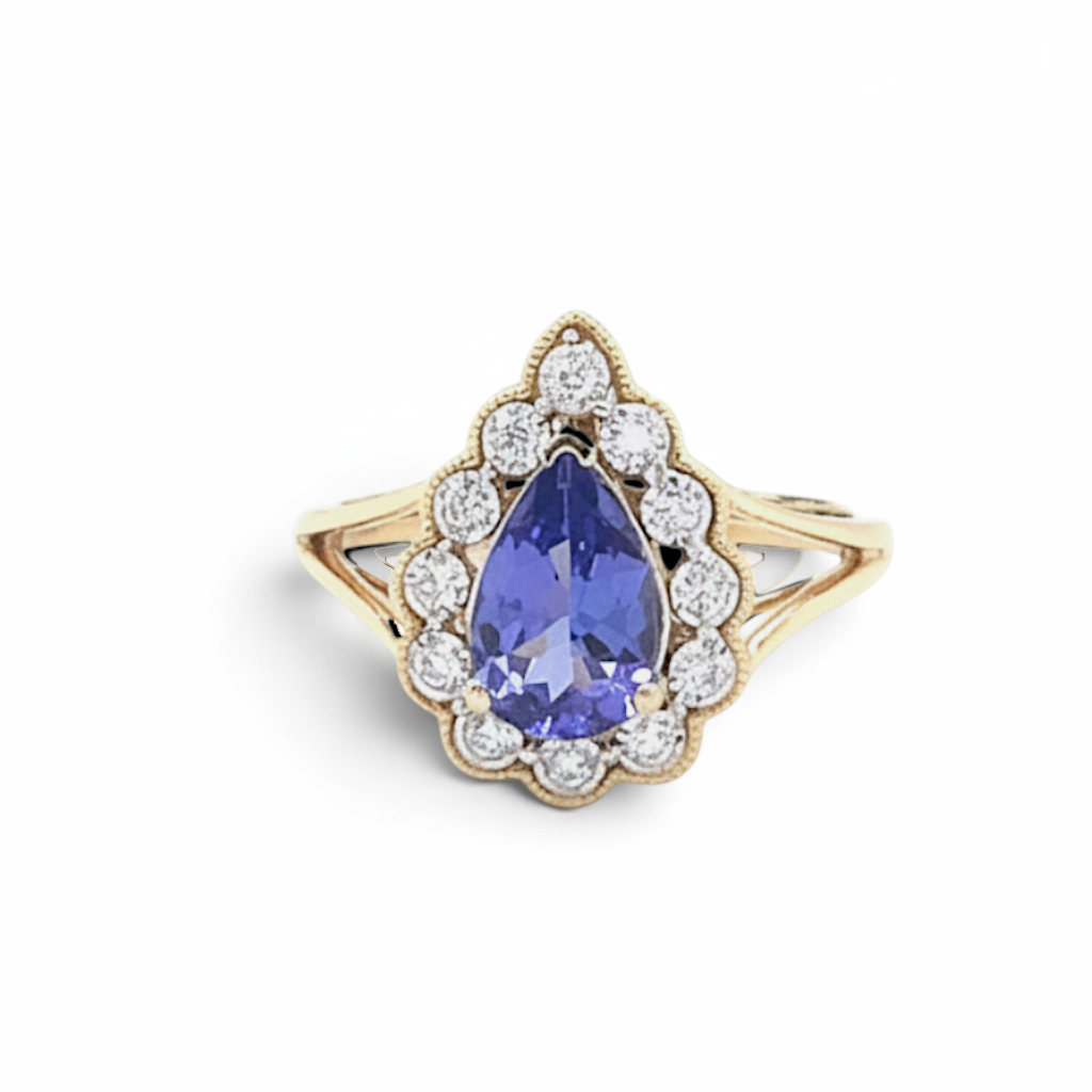 Caribbean Gems 14kt yellow gold ring featuring a pear-shaped tanzanite surrounded by a halo of sparkling diamonds.