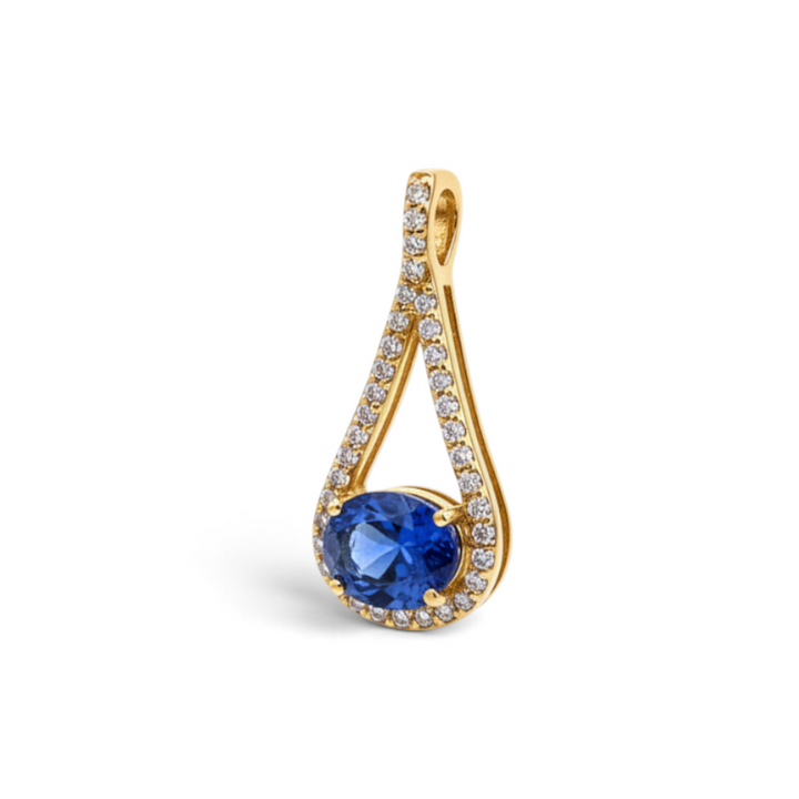 Caribbean Gems 14kt yellow gold pendant with an oval-cut blue-violet tanzanite and sparkling diamond accents.