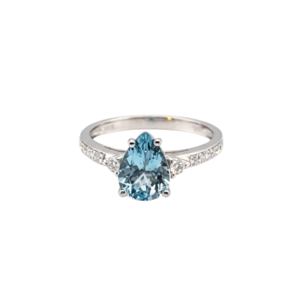 Caribbean Gems teardrop aquamarine ring with diamond accents set in 14kt white gold on a white background.