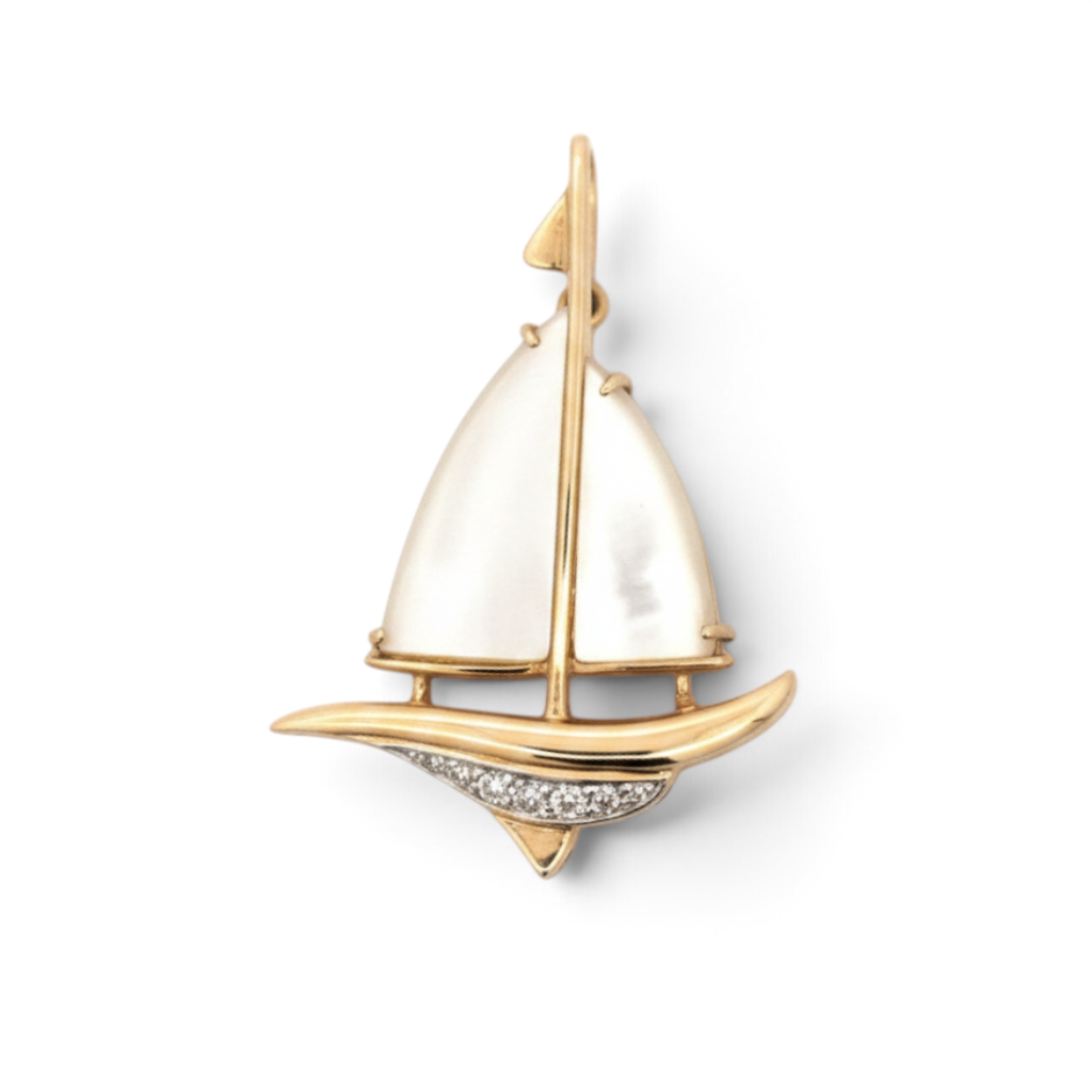 Caribbean Gems 14kt yellow gold sailboat pendant featuring iridescent mother of pearl and diamond accents.