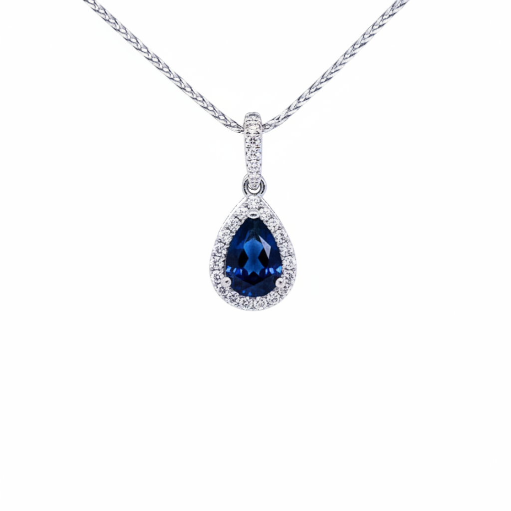 Caribbean Gems teardrop sapphire pendant in 14kt white gold with diamond halo on a delicate chain