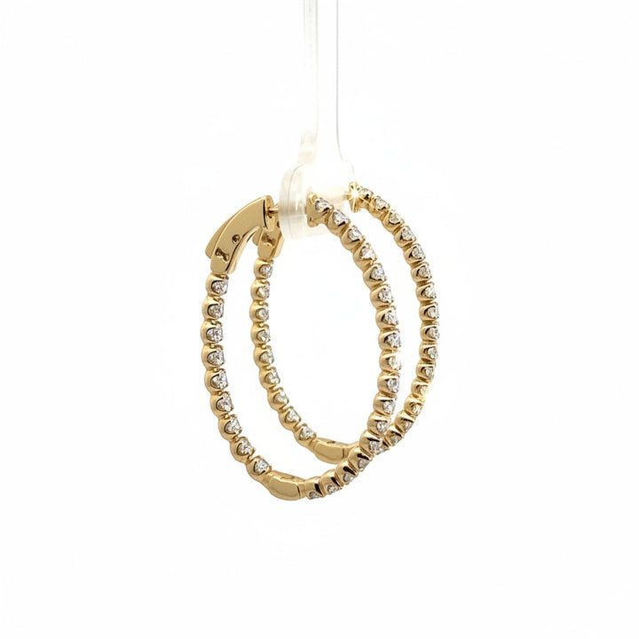 Caribbean Gems 14k yellow gold inside out hoop earrings featuring nearly 2 carats of sparkling round diamonds.