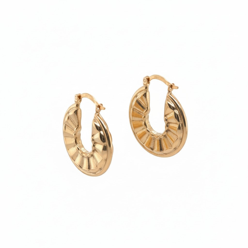 Caribbean Gems 14kt yellow gold hoop earrings with a textured, ribbed design and a polished, lustrous finish.