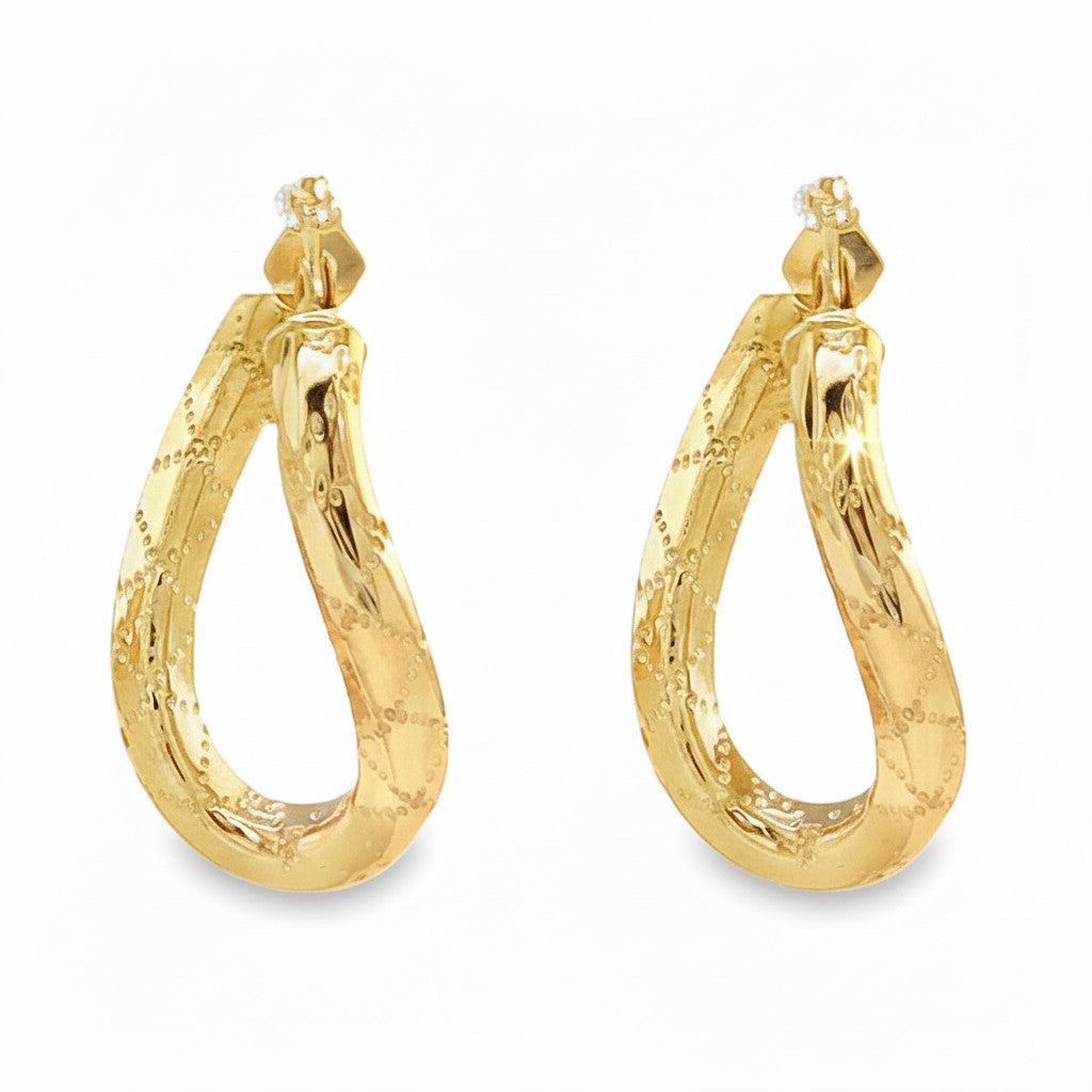 Caribbean Gems 14kt yellow gold twisted hoop earrings with a refined textured design on a white background