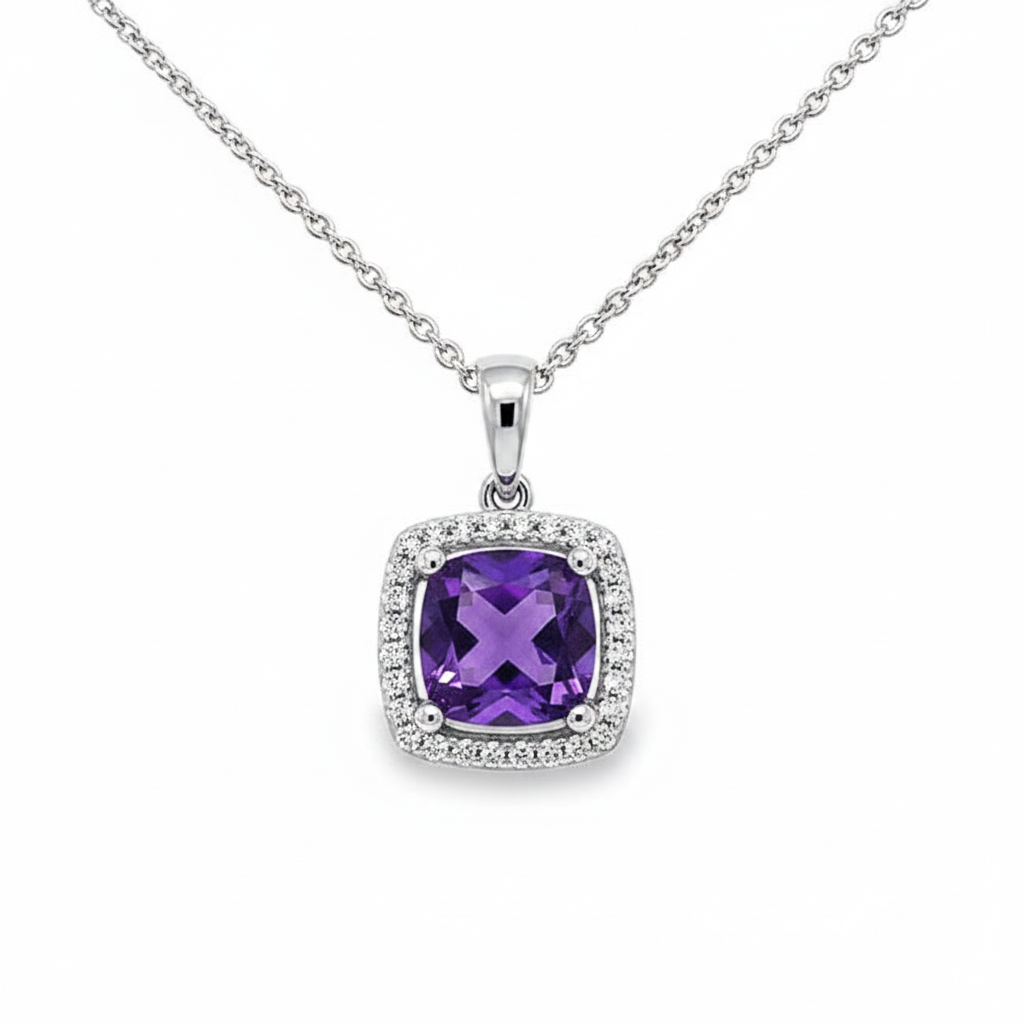 Caribbean Gems cushion cut amethyst pendant in 14kt white gold with a sparkling diamond halo on a silver chain.