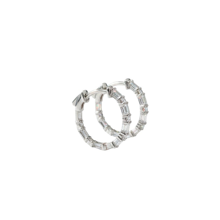 Caribbean Gems 14kt white gold hoop earrings featuring round and baguette cut diamonds on a white background.