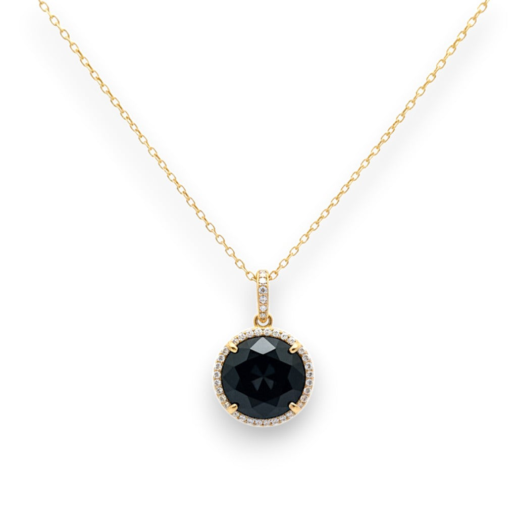 Caribbean Gems round black onyx pendant with diamond halo set in 14kt gold on a delicate matching chain.