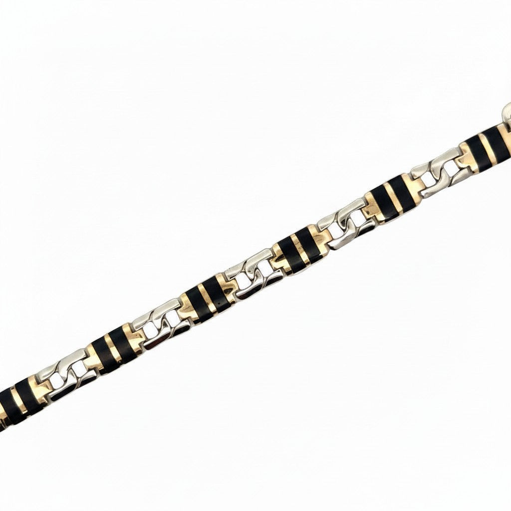 Caribbean Gems men's bracelet featuring black onyx stones and two-tone gold links in a sophisticated chain design.
