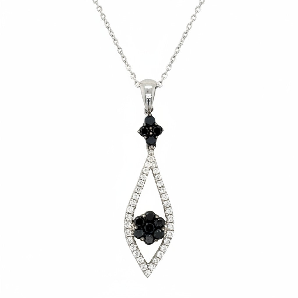 Caribbean Gems 14k white gold pendant with a 0.55ct black diamond center and sparkling white diamond accents.