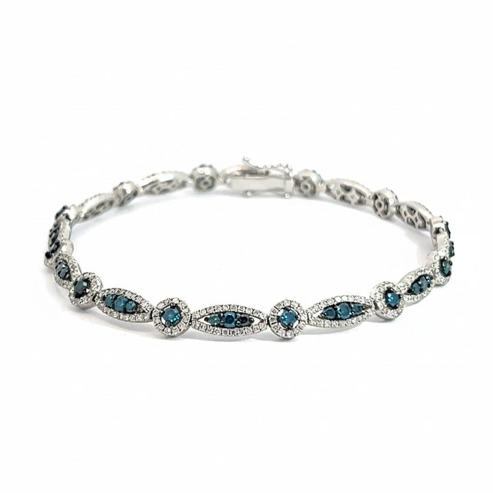 Caribbean Gems 14k gold bracelet featuring marquise and round blue and white diamonds in an elegant link design.