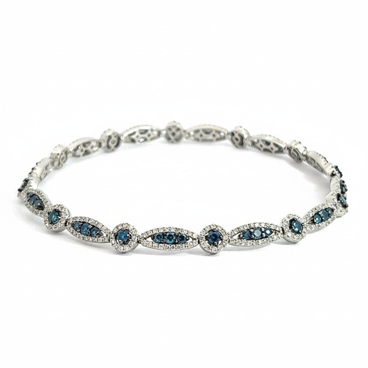 Caribbean Gems 14k gold bracelet featuring alternating marquise and round blue and white diamond settings.