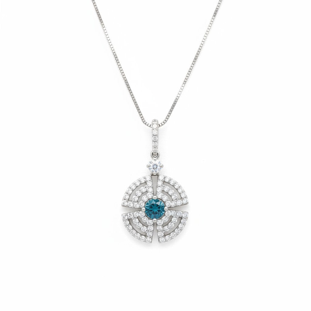Caribbean Gems 18kt white gold pendant with a central blue diamond surrounded by brilliant white diamond accents.