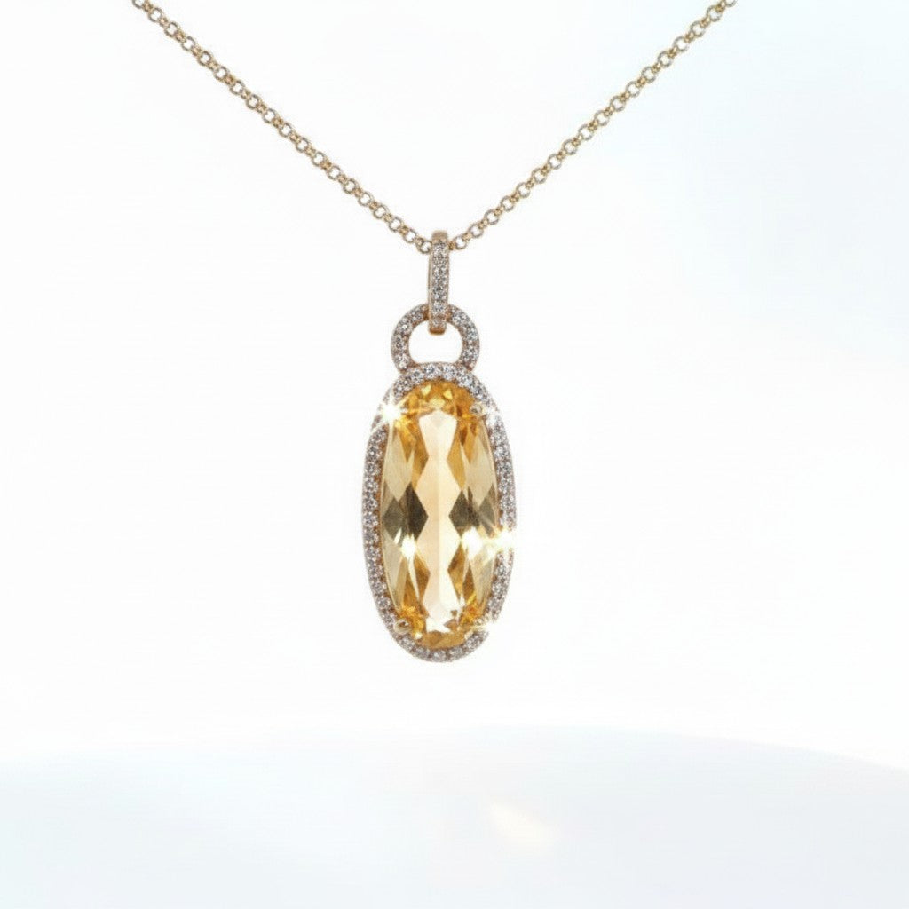 Caribbean Gems 14kt yellow gold pendant with an oval citrine stone and diamond halo on a delicate gold chain
