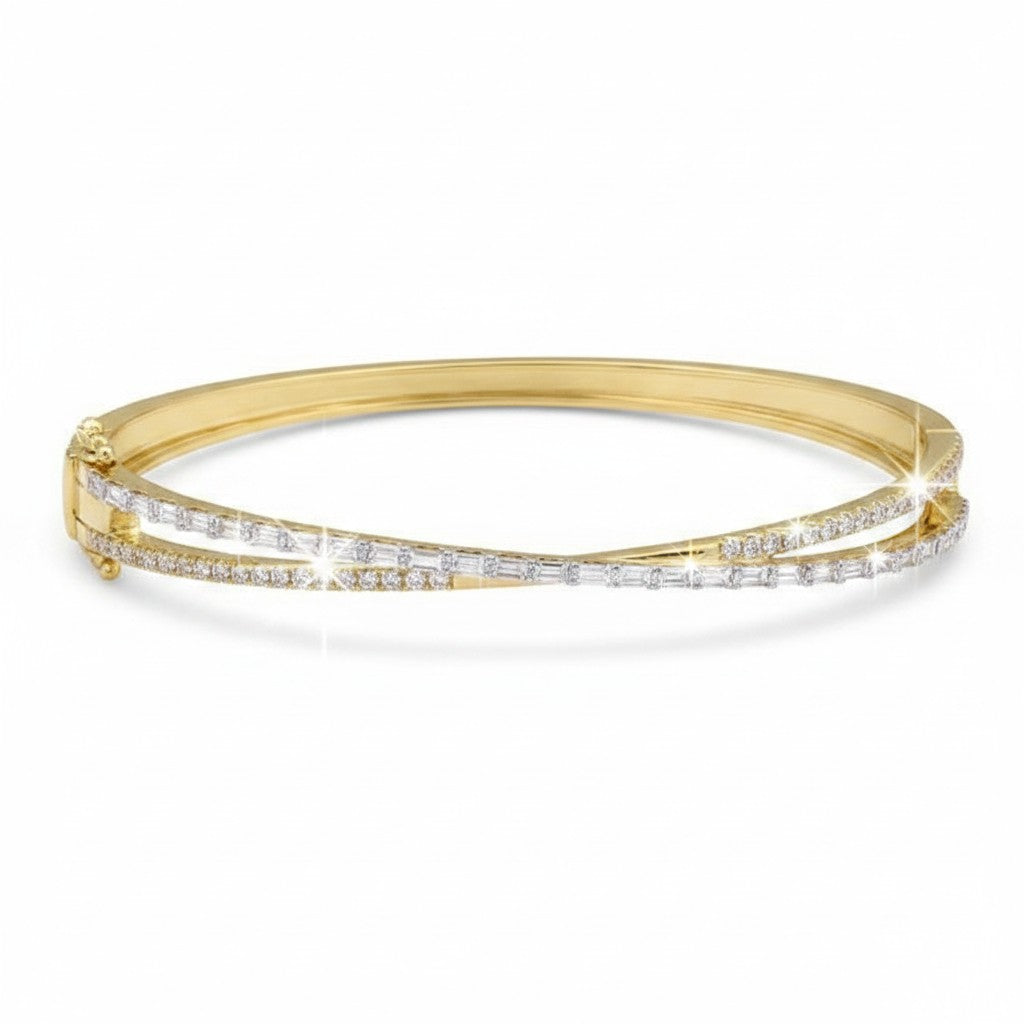 Caribbean Gems 14kt yellow gold crossover bangle featuring baguette and round diamonds totaling 0.46 carats.