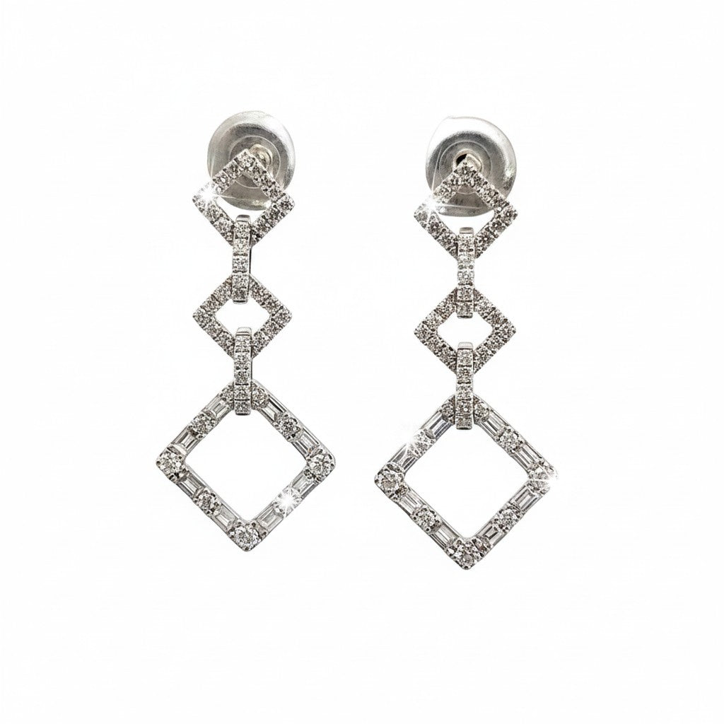 Caribbean Gems dangling diamond earrings in 18kt white gold with 1.15cts of round and baguette diamonds.