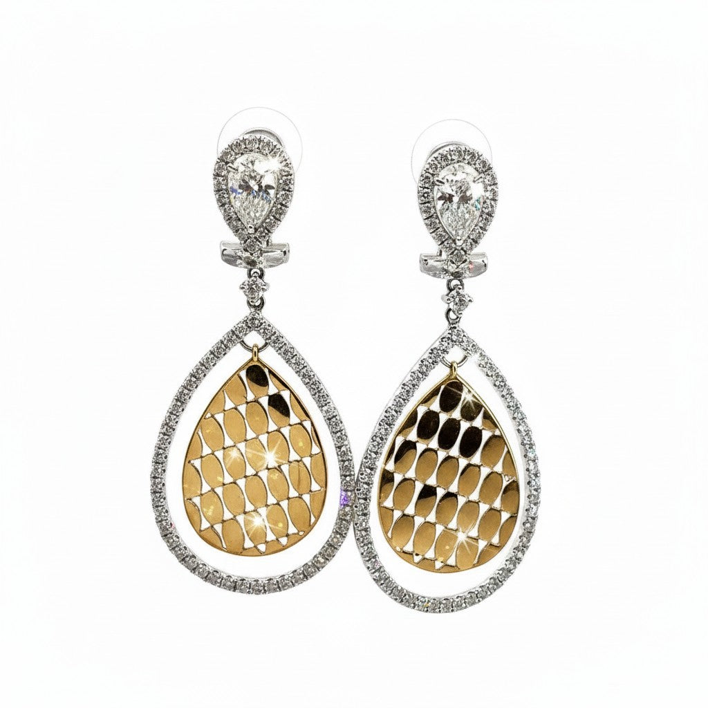 Caribbean Gems diamond drop earrings in 14kt white and yellow gold with 1.65cts of round diamonds in a pear shape.