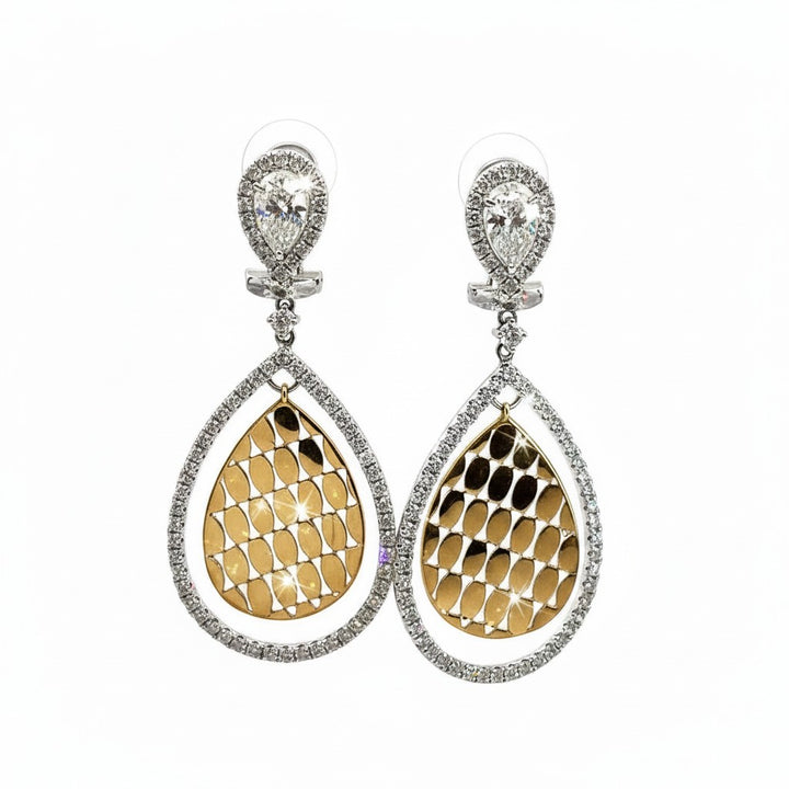 Caribbean Gems diamond drop earrings in 14kt white and yellow gold with 1.65cts of round diamonds in a pear shape.