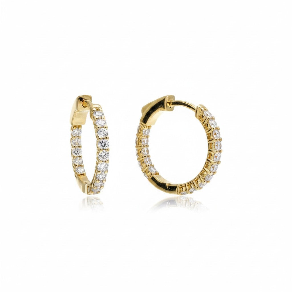 Caribbean Gems 14kt yellow gold inside out hoop earrings featuring 0.99 carat round diamonds on a white background.