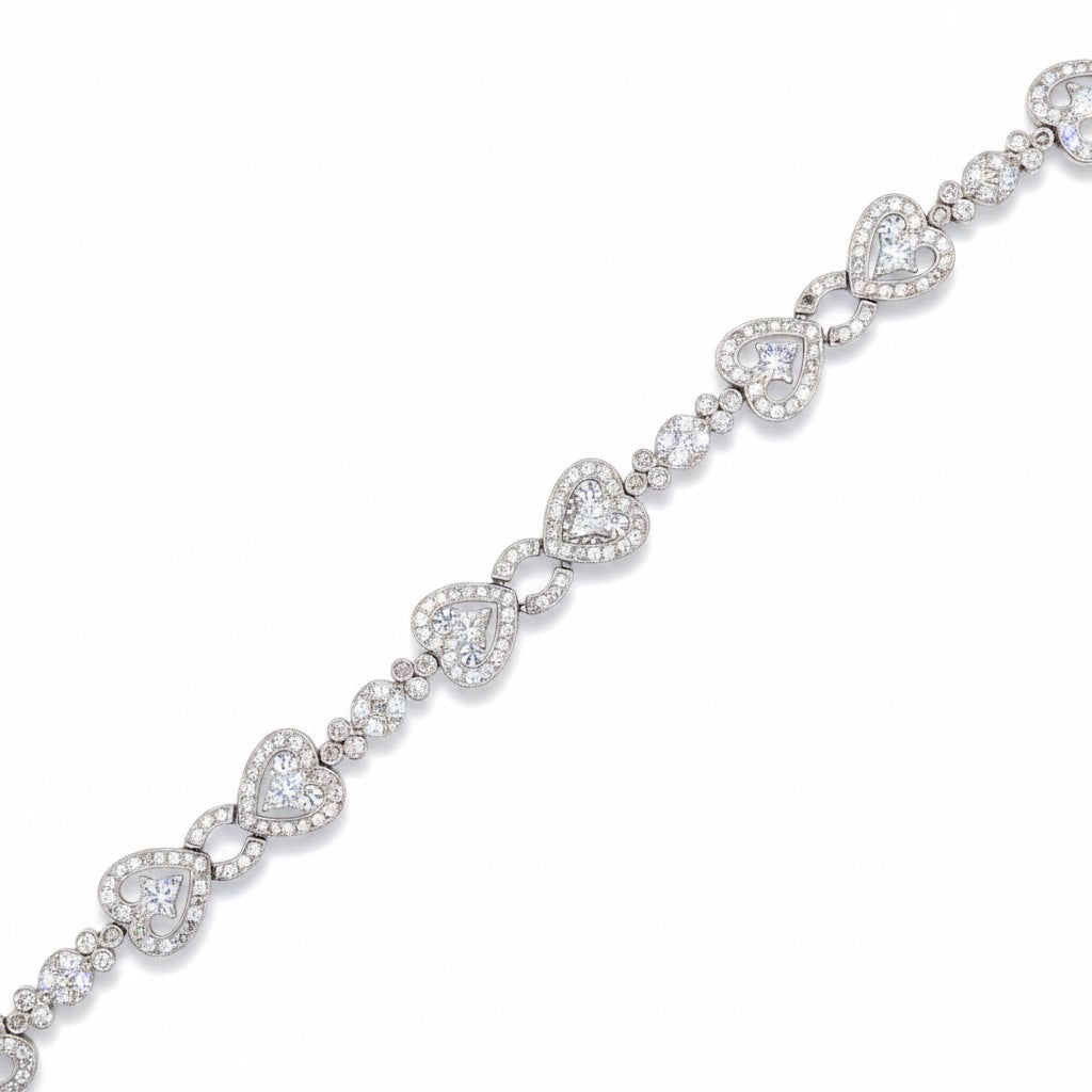 Caribbean Gems 14kt white gold heart bracelet featuring 2.32 carats of brilliant diamonds in a delicate link design.