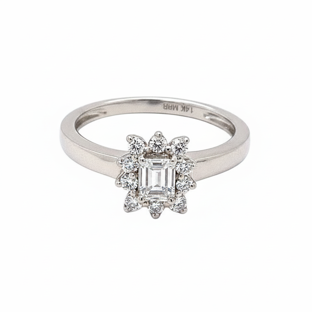 Caribbean Gems 14kt white gold ring featuring an emerald cut diamond surrounded by round accent diamonds.