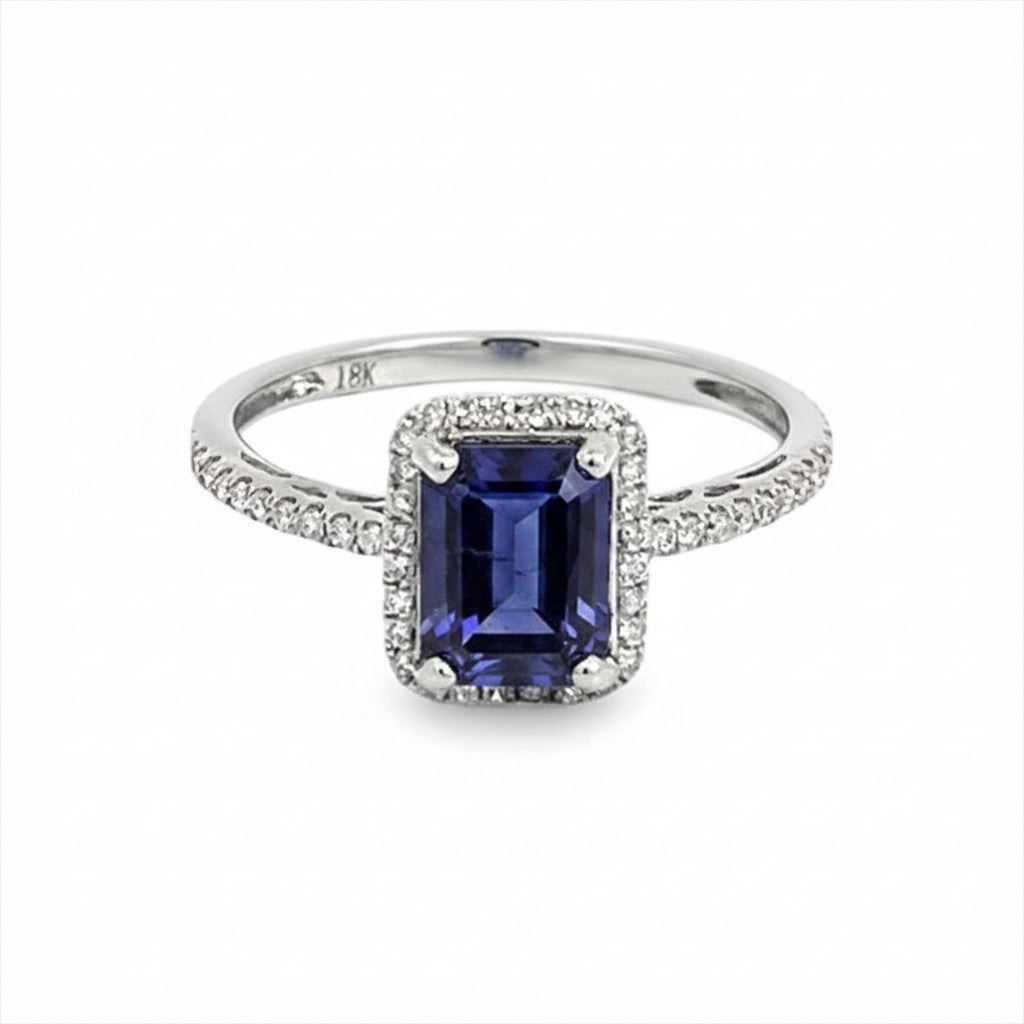 Caribbean Gems emerald-cut tanzanite ring in 18kt white gold with a diamond halo and pavé band