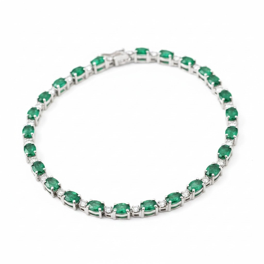 Caribbean Gems 14kt white gold bracelet with oval emeralds and sparkling diamond accents on a white background.