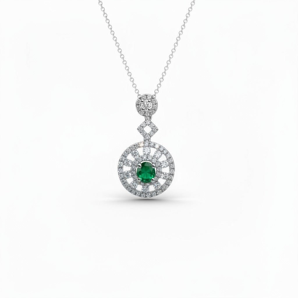 Caribbean Gems emerald and diamond pendant in 18kt white gold featuring a round green gemstone and sparkling halo.