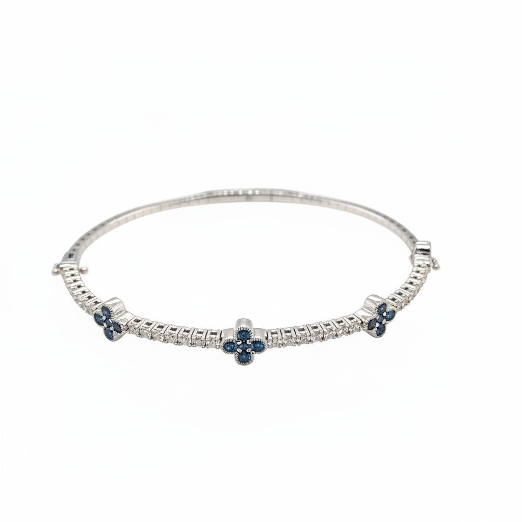 Caribbean Gems flexible 14kt white gold bangle with blue and white round brilliant diamonds in a floral motif.