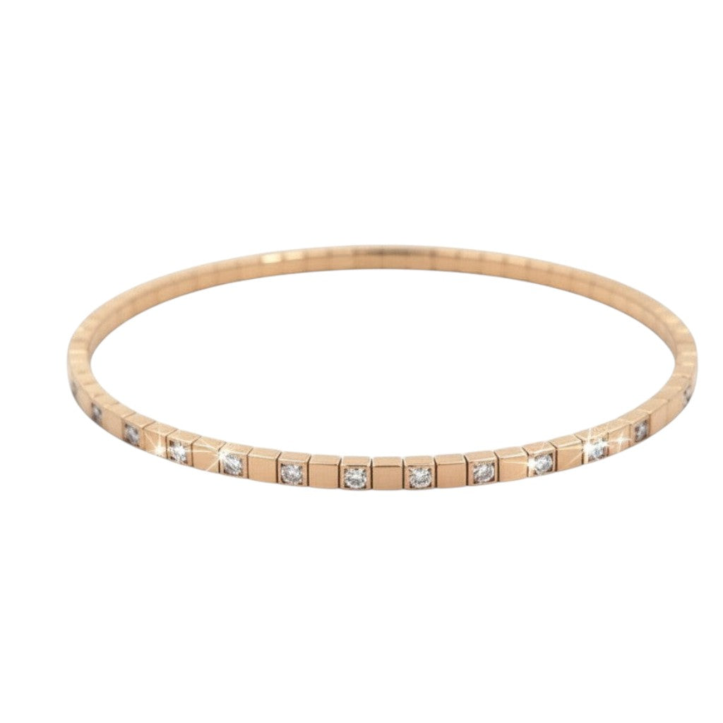 Caribbean Gems flexible 14kt yellow gold bangle with 0.88ct round diamonds in a sleek, modern link design.