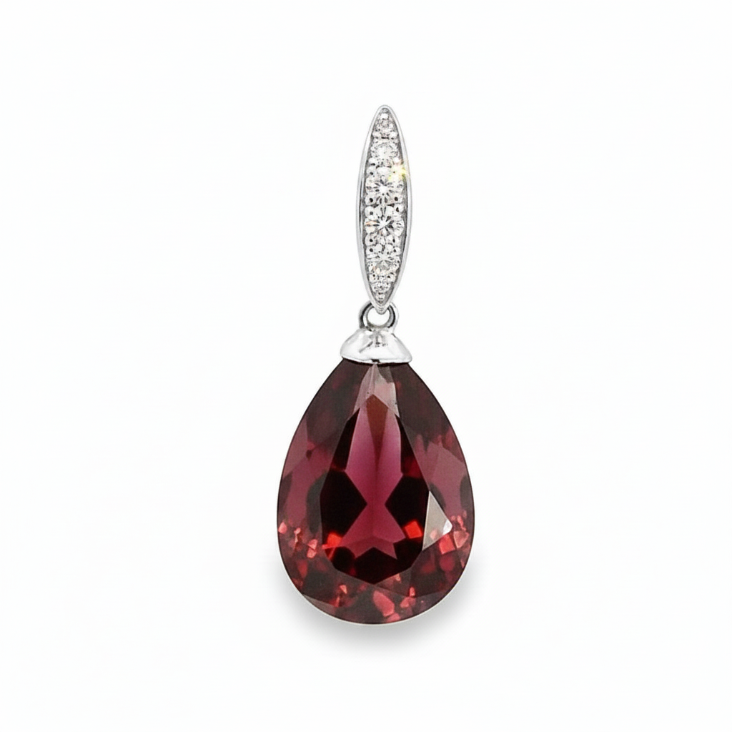 Caribbean Gems teardrop garnet pendant in 14kt white gold with diamond accents on a white background