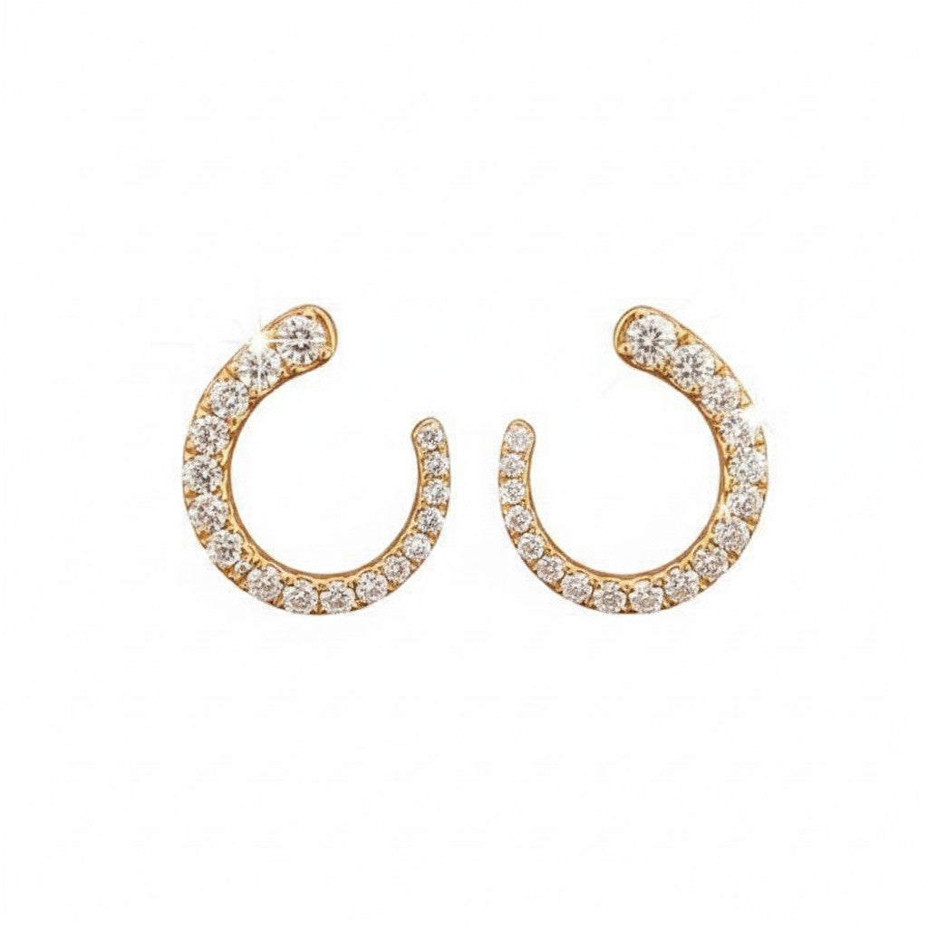 Caribbean Gems 14kt yellow gold open circle stud earrings featuring 0.51cts of round brilliant cut diamonds.