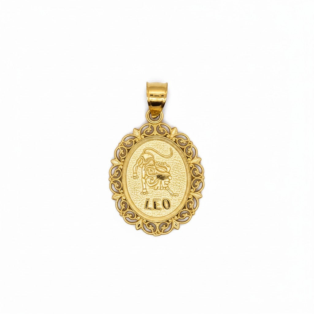 Caribbean Gems 14kt yellow gold oval Leo zodiac pendant with intricate filigree border on a white background.