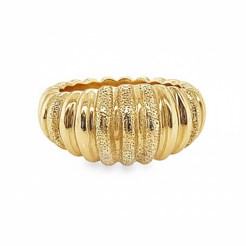 Caribbean Gems elegant gold ring featuring a textured ridged design that reflects light for a sophisticated look.