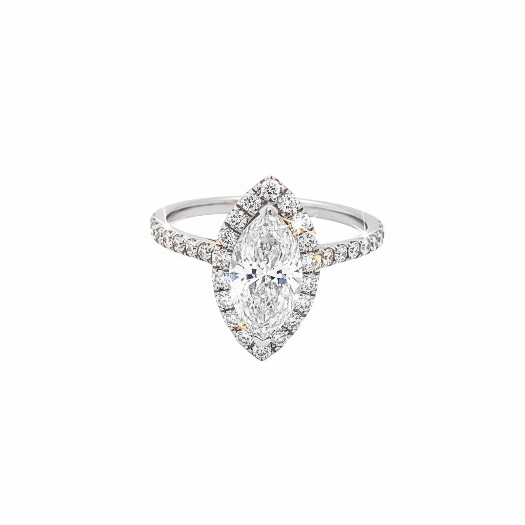 Caribbean Gems marquise diamond engagement ring with a halo setting and pavé-set diamonds on a sleek white gold band.