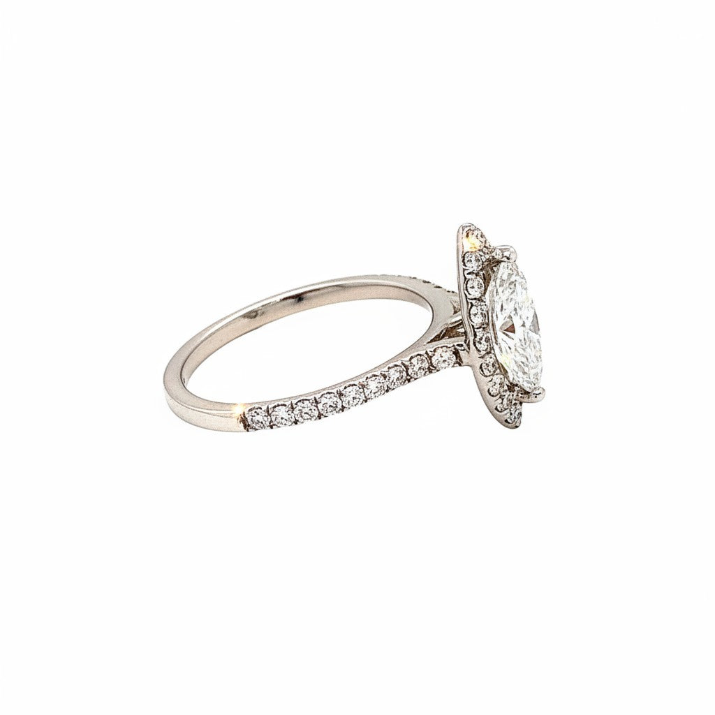 Caribbean Gems marquise diamond engagement ring with a halo setting and pavé-set diamonds on a white gold band