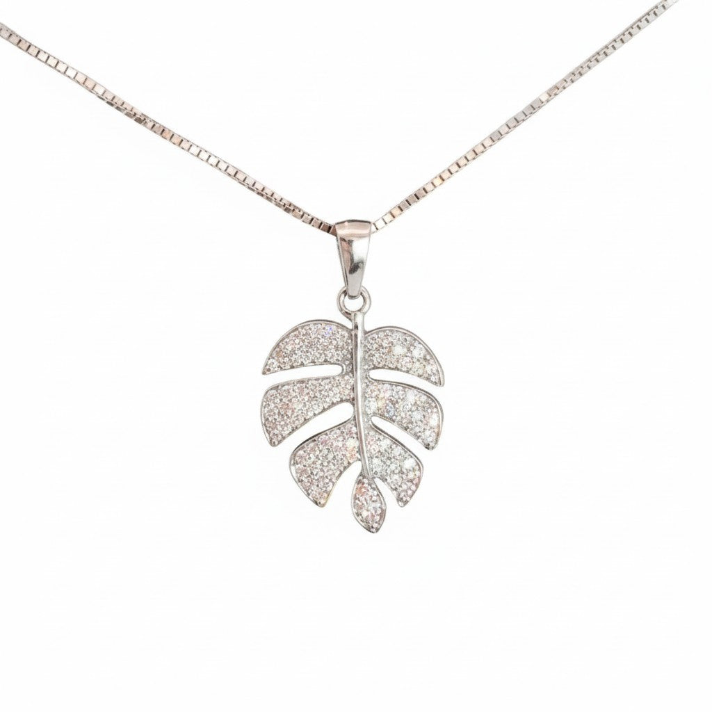 Caribbean Gems Monstera leaf pendant in 14k gold with sparkling pavé diamonds on a delicate chain