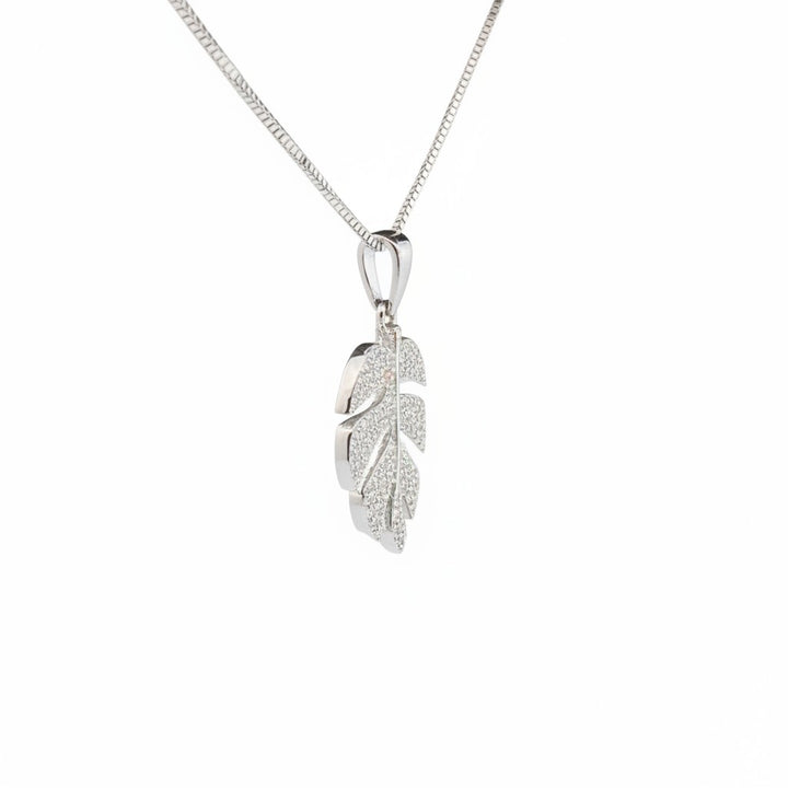 Caribbean Gems monstera leaf pendant in 14k white gold with pavé diamonds on a delicate chain