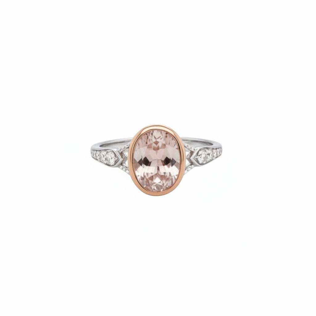 Caribbean Gems oval-cut morganite ring with diamond accents set in 14kt rose gold on a white background.
