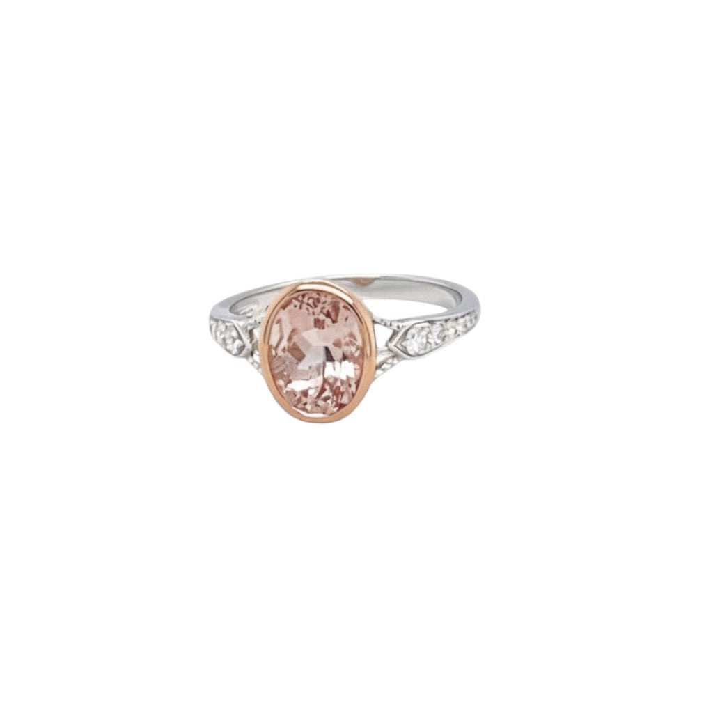 Caribbean Gems oval-cut morganite ring with diamond accents in a 14kt rose and white gold setting.