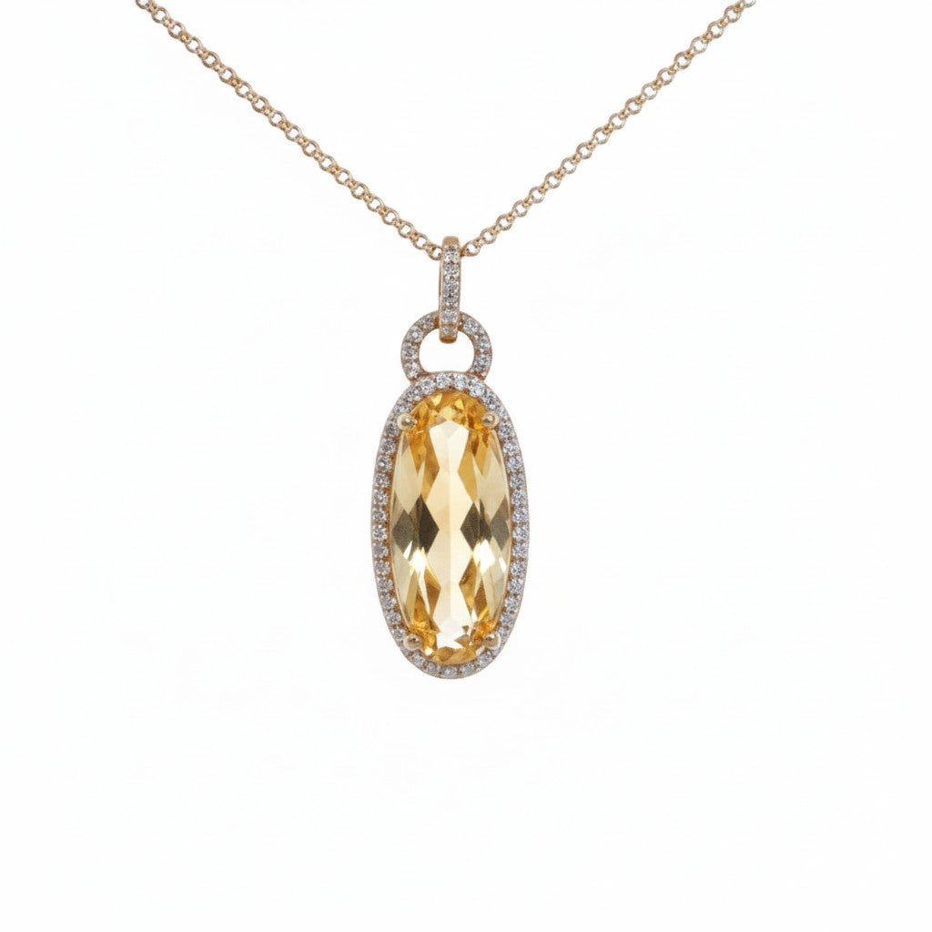 Caribbean Gems 14kt yellow gold oval citrine pendant with a sparkling diamond halo on a delicate gold chain.