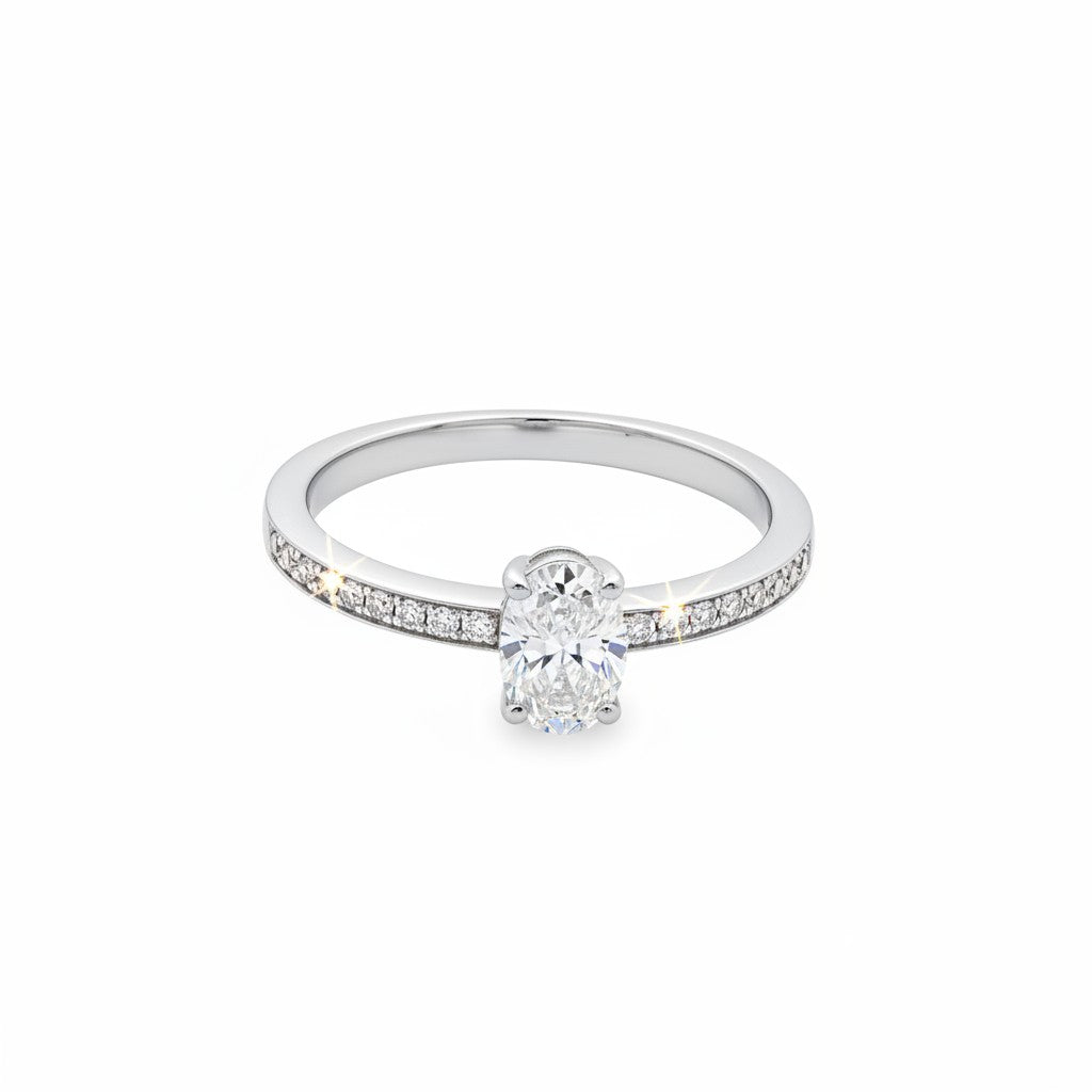 Caribbean Gems 14kt white gold ring featuring a central oval cut diamond and round cut diamond pavé band