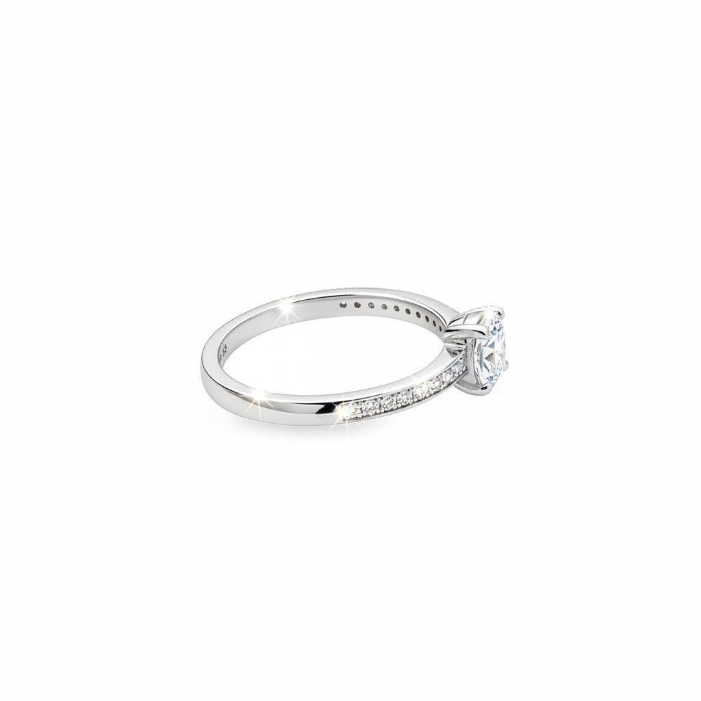 Caribbean Gems 14kt white gold diamond ring featuring a sparkling oval cut center stone and round diamond accents.