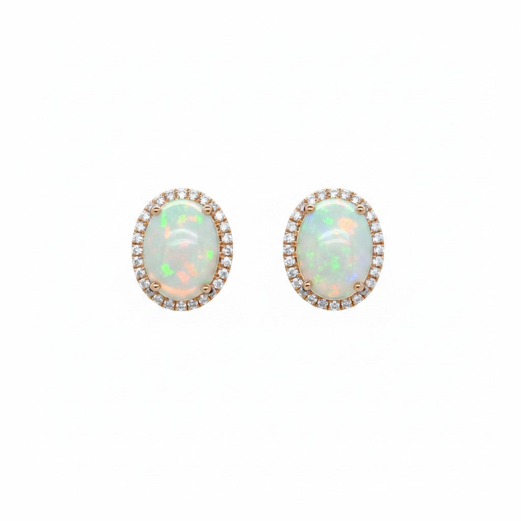 Caribbean Gems 14kt yellow gold oval opal earrings with diamond halo accents on a white background