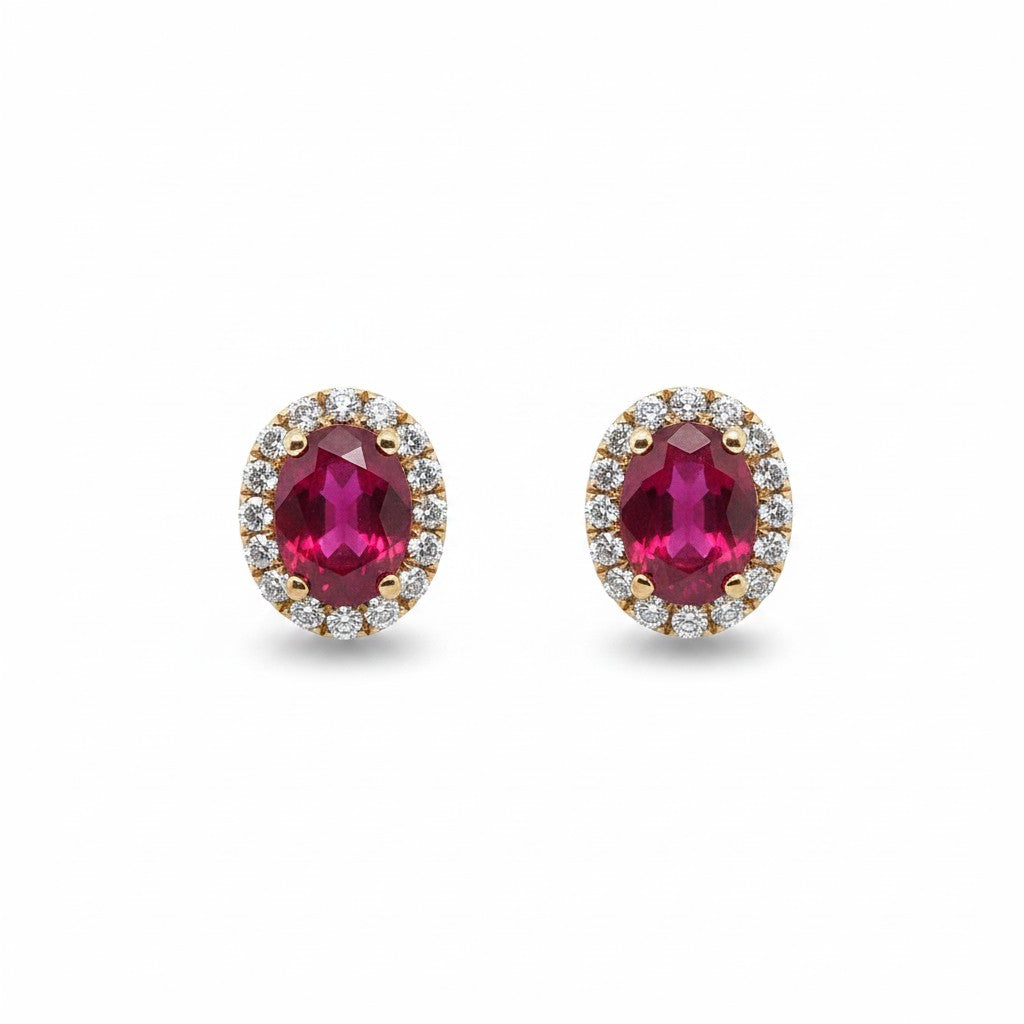Caribbean Gems oval ruby and diamond halo earrings set in 14kt yellow gold