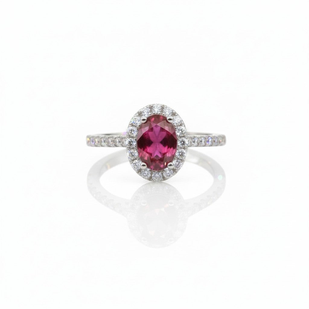 Caribbean Gems 14kt white gold ring featuring an oval ruby centerpiece surrounded by sparkling round diamond accents.
