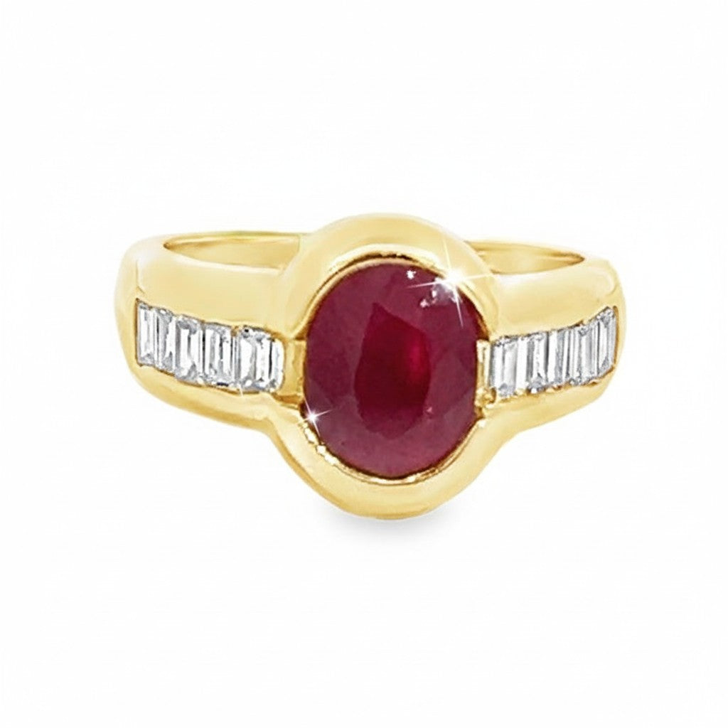 Caribbean Gems 18kt yellow gold ring featuring a 2.06ct oval ruby flanked by baguette diamonds.
