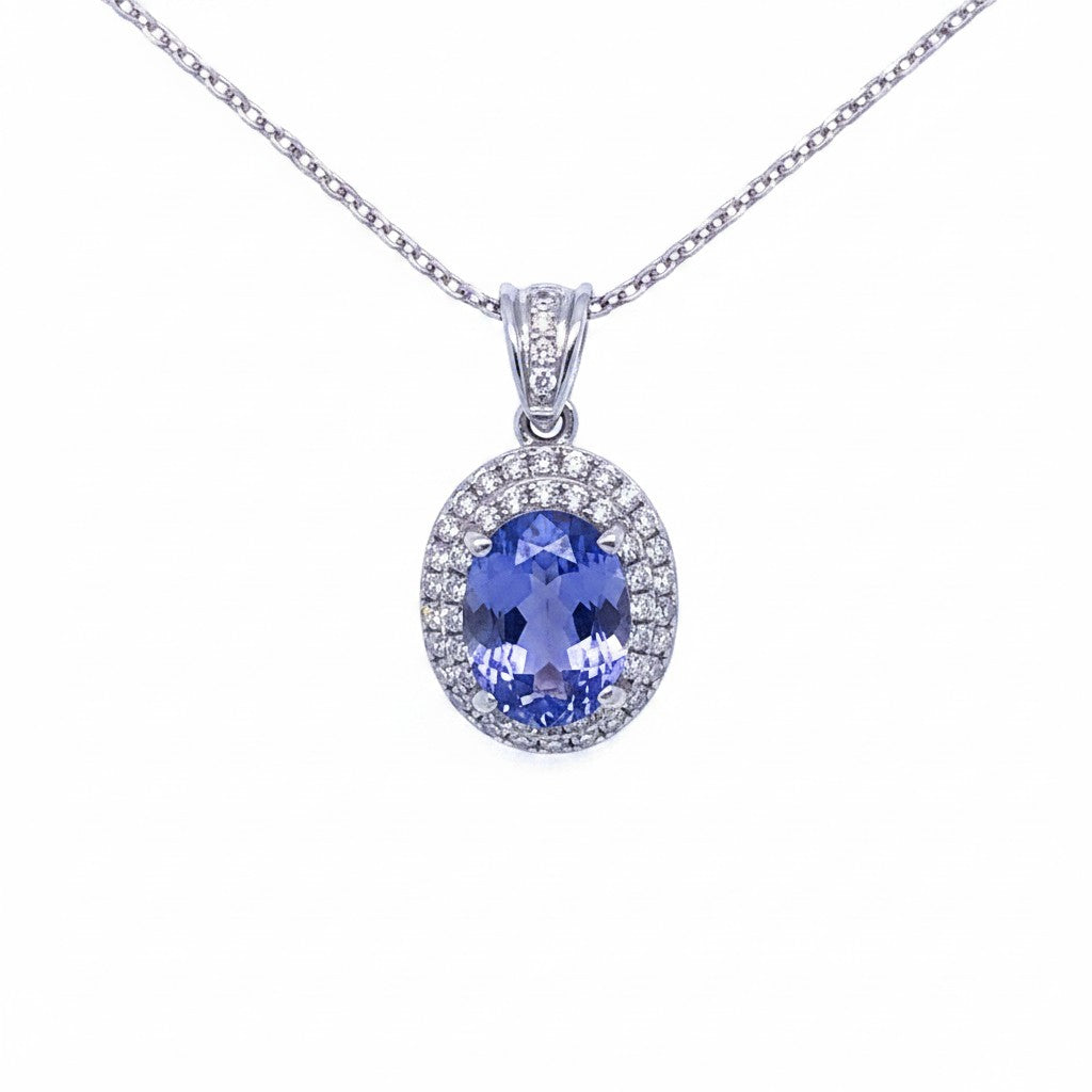 Caribbean Gems oval tanzanite pendant with diamond halo in 14kt white gold on a delicate chain