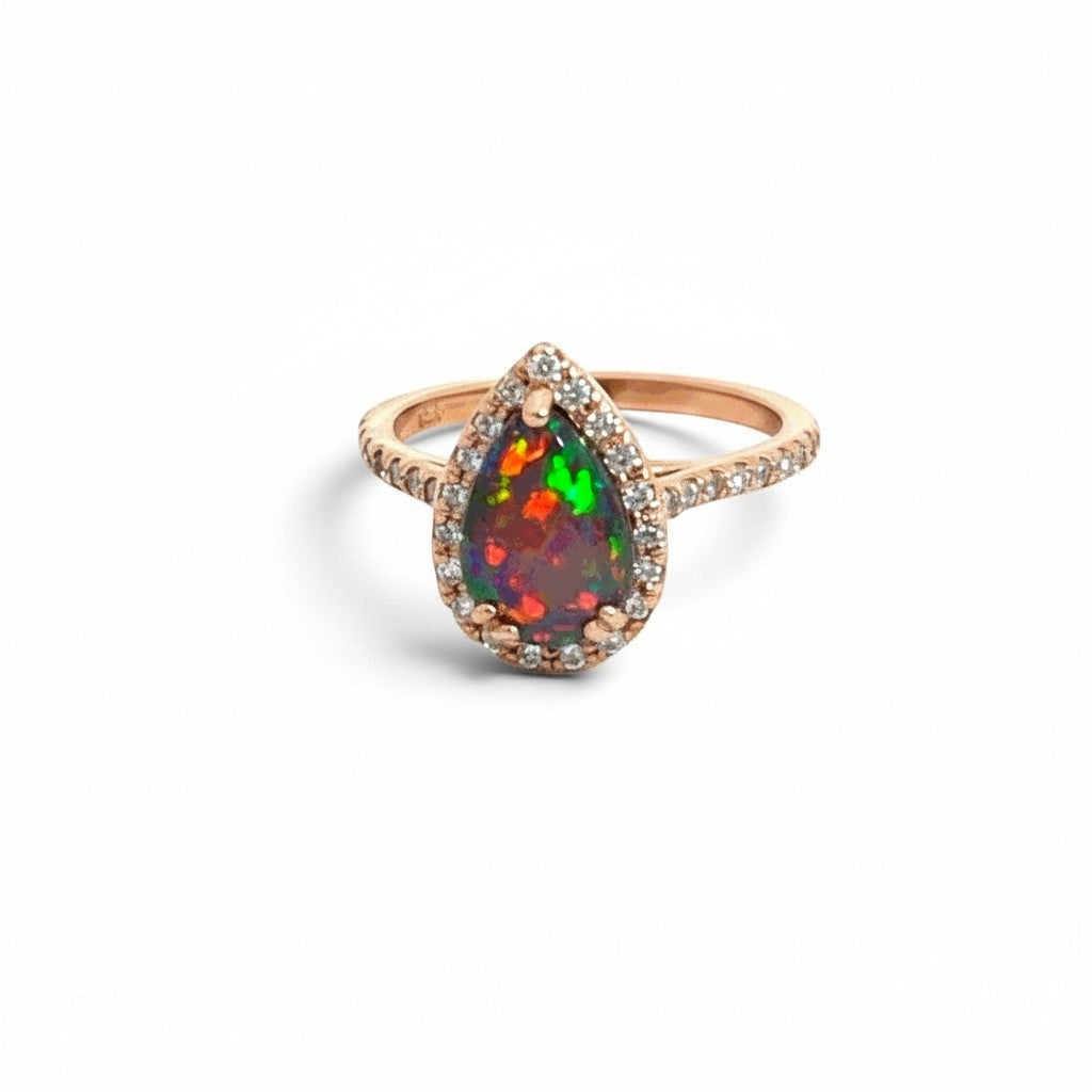 Caribbean Gems pear-shaped opal and diamond ring in 14kt rose gold with a vibrant play of color.