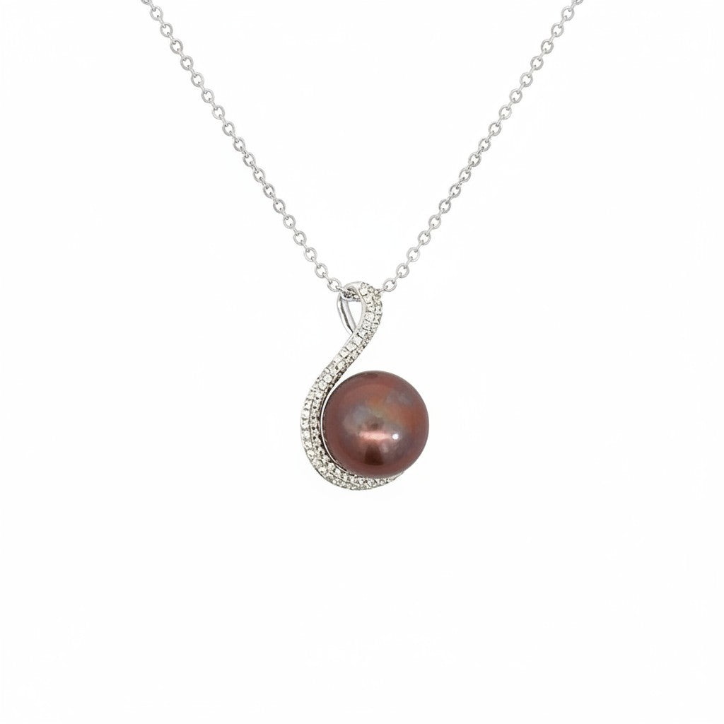 Caribbean Gems 14kt white gold pendant featuring a dark lustrous pearl accented by sparkling diamonds on a chain.